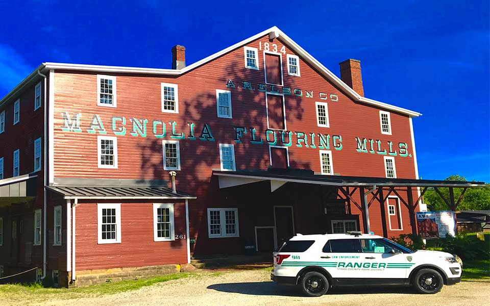 Ranger Vehicle Parked in front of Mill building